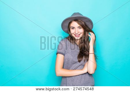 Young Woman In Floppy Hat Posing. Portrait Of Beautiful Girl With Long Hair, In Gray Floppy Hat, Pos