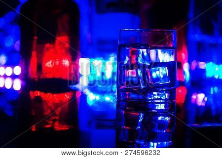 Colored Lighting Of Glasses In The Night Club Bar