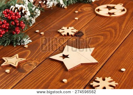 Spruce Branches, Cones And Red Berries On A White Wooden Background. Background For Christmas And Ne