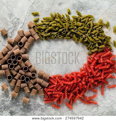 Colored Gluten-fmulticolor Gluten-free Pasta With Ingredients From Which It Is Made On A Stone Table