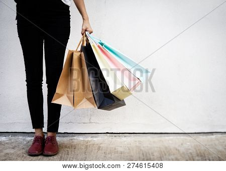 Shopping Bags Were Hlding By Woman Crazy Shopaholic Person At Shopping Mall.colorful Paper Shopping 