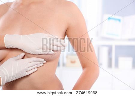 Doctor Checking Woman's Breast At Hospital, Closeup