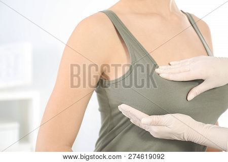 Doctor Checking Woman's Breast At Hospital, Closeup