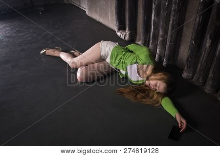 Lifeless Unconscious Woman Lying On A Factory Floor