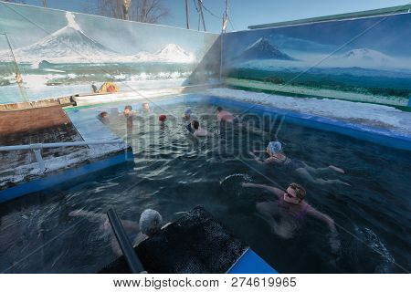 Zelenovskie Ozerki, Kamchatka Peninsula, Russian Far East - December 25, 2016: Group Of People Swimm