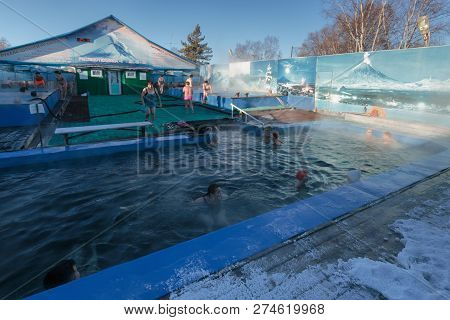 Zelenovskie Ozerki, Kamchatka Peninsula, Russian Far East - December 25, 2016: Group Of People Bathi
