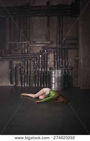 Lifeless Unconscious Woman Lying On A Factory Floor