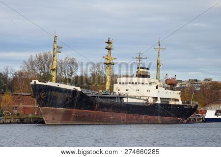 Big Old And Rusty Sea Transport Vessel In The Harbour.