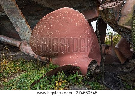 Huge Bronze Screw Of The Abandoned On The Shore Of A Warship.