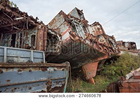 Huge Rusty Pieces Of Decommissioned Marine Ship That Was Cut And Left On The Shore.