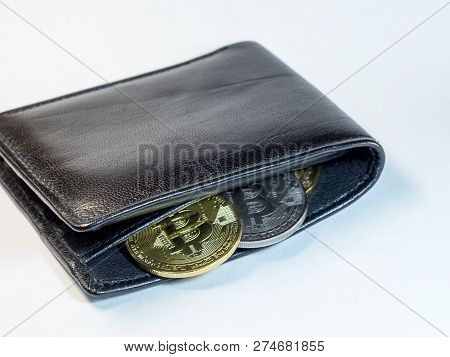 Coins Bitcoin In A Purse On A White Background