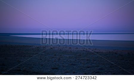 Panorama View To Aral Sea From The Rim Of Plateau Ustyurt Near Aktumsuk Cape At Sunset In Karakalpak