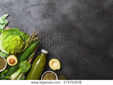 Assorted Green Toned Raw Organic Vegetables On Dark Background. Avocado, Cauliflower And Cucumber Wi