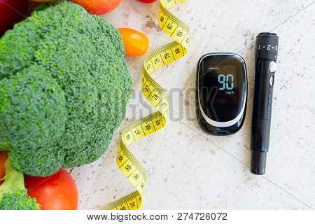Raw Vegetables With Blood Glucose Meter And Lancet On Desktop, Diabetes Healthy Diet Concept