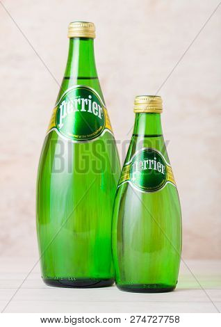 London, Uk - September 03, 2018: Bottles Of Perrier Sparkling Water On Wooden Background. Perrier Is