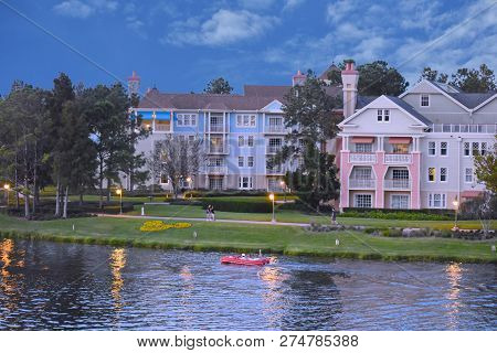 Orlando, Florida. November 24, 2018 People Enjoy Amphicar Ride On Victorian Style Hotel Background  