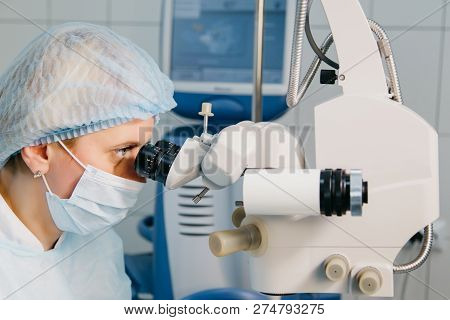 Surgeon With Operating System Of Laser Vision Correction In The Operating Room. Ophthalmology. Medic