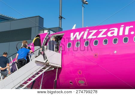 Gdansk, Poland - May 28, 2018: People Embarking To Wizz Air Plane At The Airport.