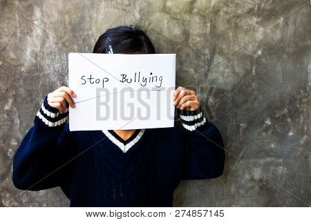 Girl With Stop Bullying Sign, Stop Bullying Concept. Bullying Is Unwanted And Aggressive Behavior. I