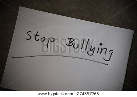 Stop Bullying Text Write On White Paper. Bullying Is Unwanted And Aggressive Behavior. It Considered