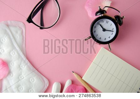 Women's Cycle Hyhienic Pads And Tampons On Pink Background. Copy Space.
