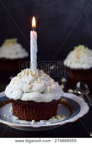 Chocolate Cupcake With Vanilla Cream And Candle. Happy Birthday. Dark Photo