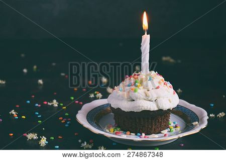 Chocolate Cupcake With Vanilla Cream And Candle. Happy Birthday. Dark Photo