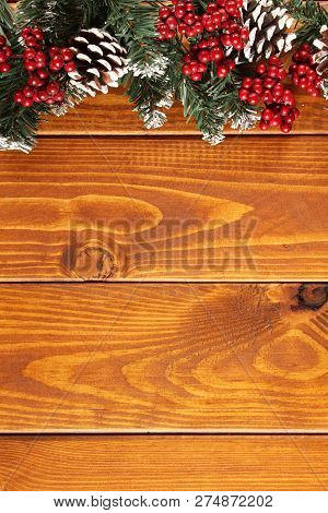 Spruce Branches, Cones And Red Berries On A White Wooden Background. Background For Christmas And Ne