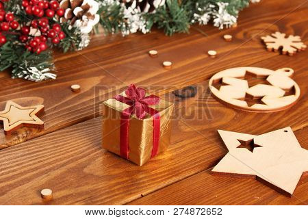 Spruce Branches, Cones And Red Berries On A White Wooden Background. Background For Christmas And Ne