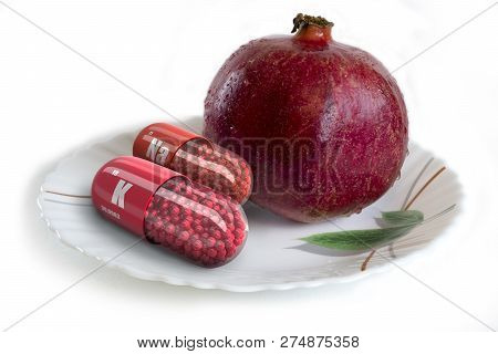 3d Illustration. Big Ripe Red Granet On A White Plate