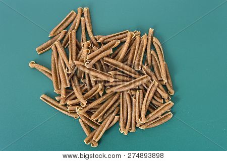 Detail Of Pasta Casarecce On Blue Background