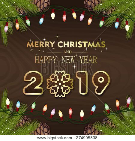Happy New Year 2019. Congratulatory Inscription On A Wooden Surface With Fir Branches And Electric G