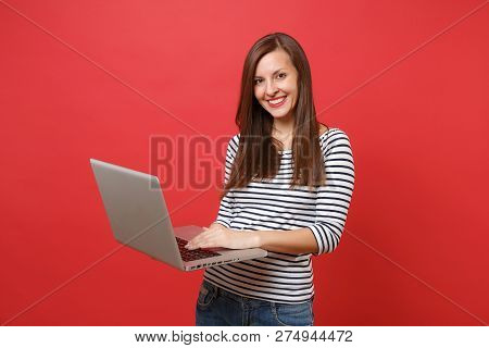 Portrait Of Stunning Young Woman In Casual Striped Clothes Holdi
