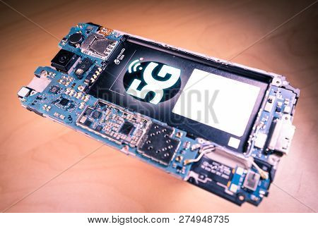 Disassembled Mobile Phone Or Smartphone Without A Back Cover, And 5g Or Lte Word Printed In Circuit 