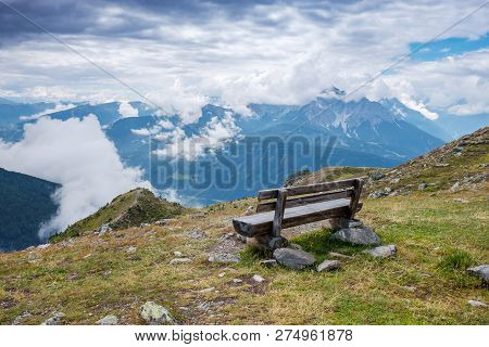 Observation Deck With A Bench In The Alpine Mountains Overlooking The Valley