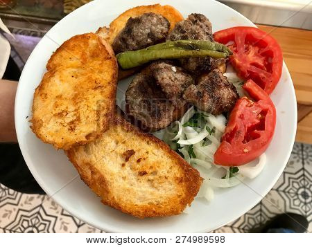Turkish Meatball Food Islama Kofte With Fried Bread Slices From Adapazari / Kofta. Traditional Food.
