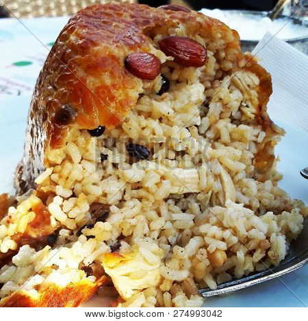 Turkish Perde Pilavi / Drape pilaf with chicken, almond and raisin (Turkish Siirt Kitchen)