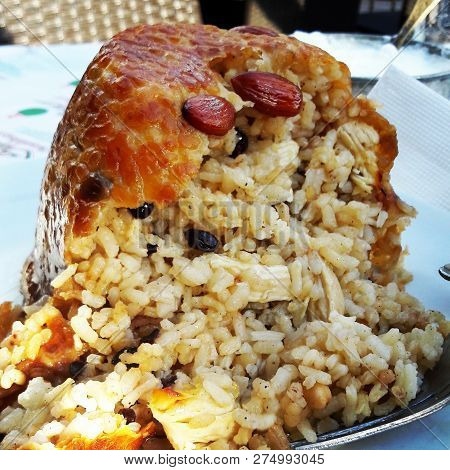 Turkish Perde Pilavi / Drape pilaf with chicken, almond and raisin (Turkish Siirt Kitchen)