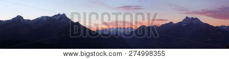 Panoramic View Of A Mountain Range At Dawn