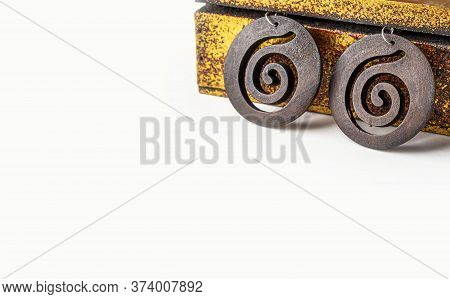 Handmade Ethnic Wooden Earrings Of Antique Metallic Vintage Casket On White Background. Ancient Asia