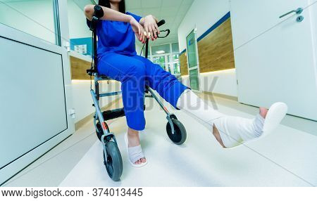 Patient On Rollator With Hand Brakes Moving In Hospital
