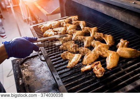 Fried Chiken Wings At Grill Barbecue. Restaurant.