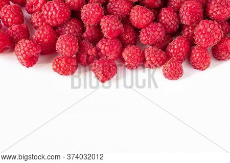 A Lot Of Raspberries On A White Background, Close-up, Red, Ripe, Juicy Berries Raspberries Layout Fo