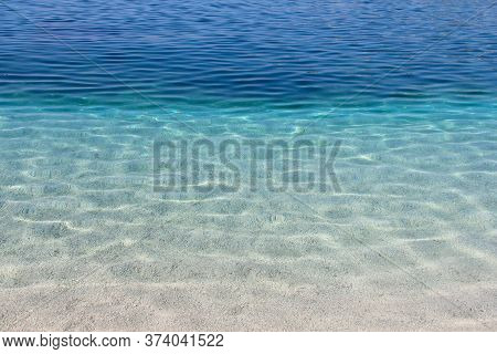 Sea Water Near Beach Natural Background , White Stone Pebble Beach In Croatia Sumartin Brac Island P