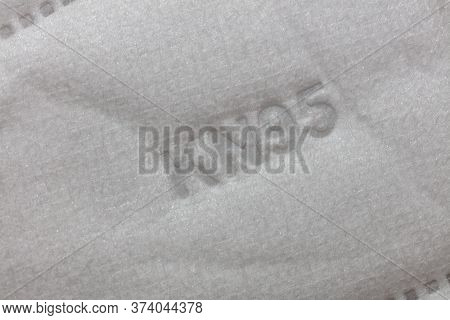 Part Of Kn95 Standard Facial Mask With Kn95 On It. Close-up Shot. Healthcare System Concept.