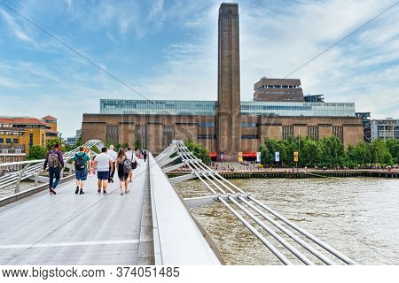 LONDON,UK - JULY 25,2019 :  The Millennium Bridge and the Tate Modern museum in London