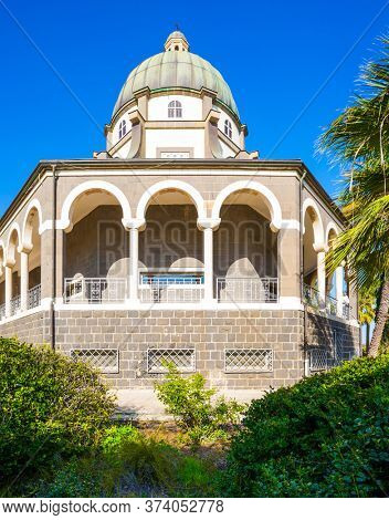 The Catholic Church of the Beatitudes of the Franciscan monastery on Mount Bliss. The Sea of Galilee. Blooming huge park around the monastery. Israel. The concept of religious pilgrimage 