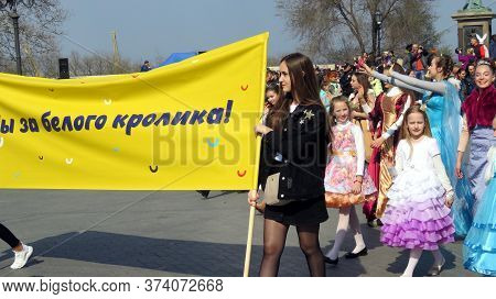 Odessa, Ukraine - 04 01 2019: Girls On Boulevard With A Yellow Banner: For A White Rabbit!