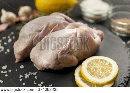Raw Quail Meat On Kitchen, Cooking Gourmet Bird. Healthy Diet Recipe.