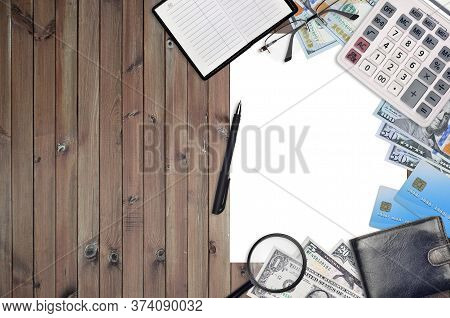 Office Flat Lay Composition With Calculator, Address Book And Other Office Items On Brown Wooden Tab